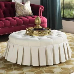 Luciana Antique White Tufted Footstool Cocktail Ottoman with Skirt by Jennifer Taylor